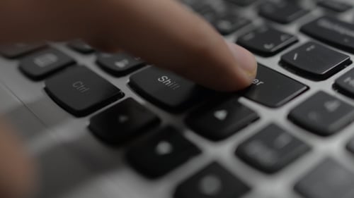 Typing on Laptop Keyboard in Close Up