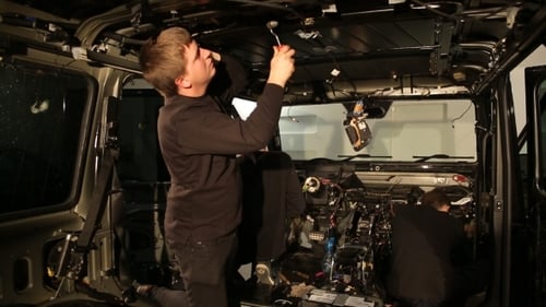 Man Engaged In Sound Insulation Of The Roof Of The