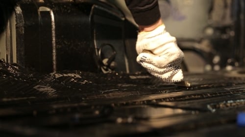 Applying Sound Dampening Sheet to Car Floor