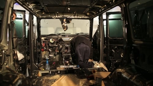 Mechanics Repairing Car Interior at Automotive Workshop
