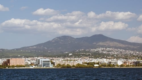 View Of Coastal City From Sailing Ship