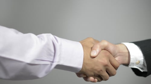 Successful Business Handshake in Corporate Setting