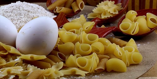 Raw Pasta Ingredients with Eggs and Flour