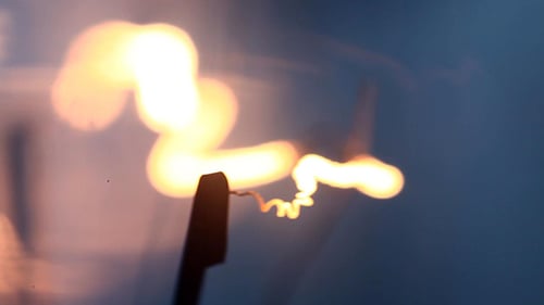 Sparks Generating with a Light Blue Background