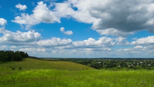 Landscape, Clouds Moving Over a Field With Trees.