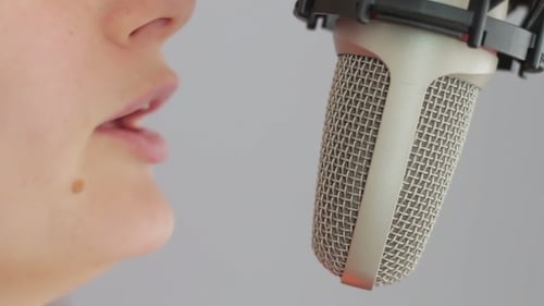Girl Sings In The Studio Microphone