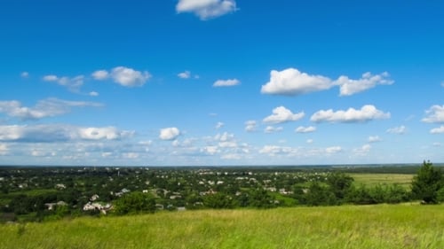Landscape, Clouds Moving Over a Field With Trees.