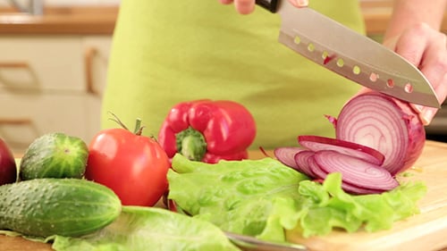 Vegetables Being Sliced in the Kitchen