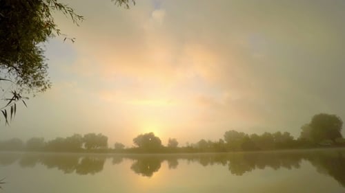 Sunrise in Fog on River Water.