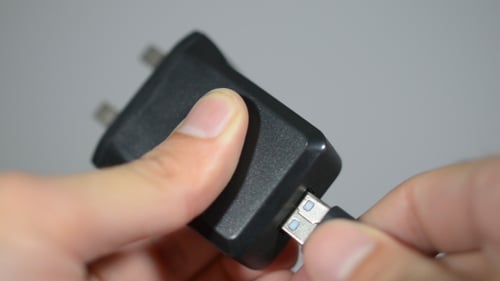 USB Charger Chord Pluggged in of Socket Plug