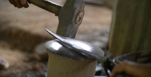 Blacksmith Working On Metal