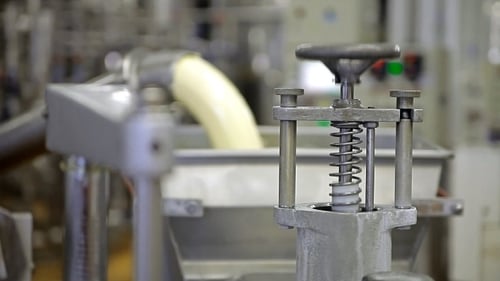 White Substance Pours in Industrial Factory