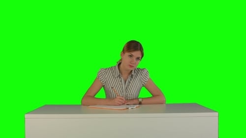 Young Girl Sitting In Classroom At Lecture And