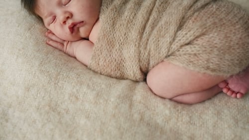 Cute Newborn Baby Sleeping On a Blanket
