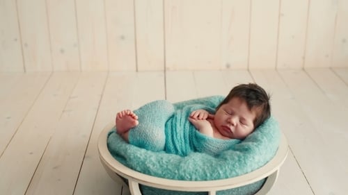 Cute Newborn Baby Sleeping On a Blanket