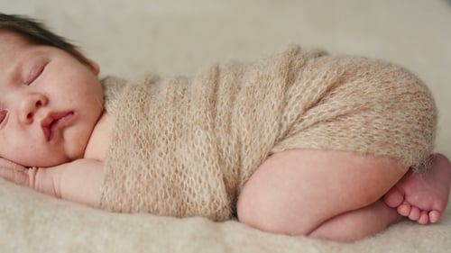 Cute Newborn Baby Sleeping On a Blanket