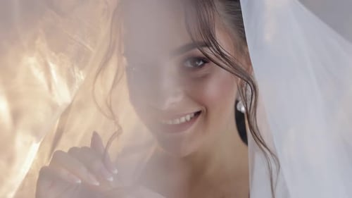 Happy Woman Smiling Under Wedding Veil