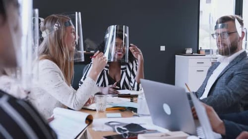 Safety Measures Against COVID-19 at Workplace. Multiethnic Business Team Meet in Modern Office in