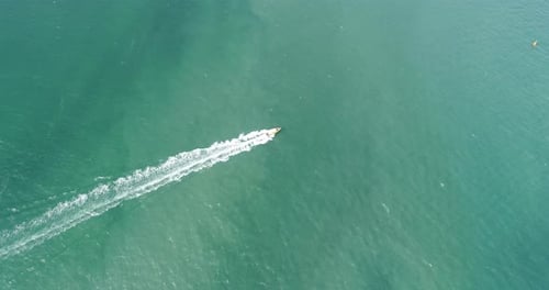 Aerial view of speed boats on the sea near beach city
