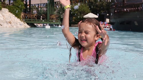 Little Girl Having Fun in a Swimming Pool