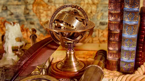 Vintage Books, Quill Pen, and Exploration Equipment