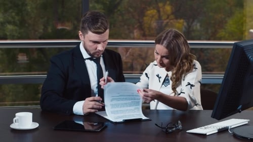 Attractive Man Signs Document