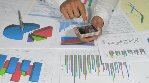 Businessman Working on Smartphone in Office