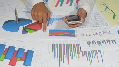 Businessman Using Smartphone for Office Work