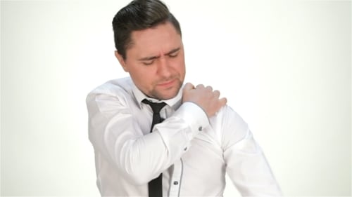 Man Massaging His Neck and Shoulder