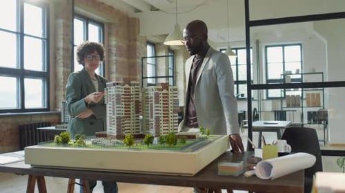 Diverse Architects Working Together on Project in Office