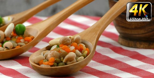 Raw Legumes and Lentils in Wooden Spoons