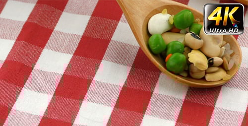 Wooden Spoons with Peas and Beans on Cloth