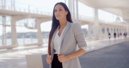 Stylish Woman With Long Hair Standing On a Mobile
