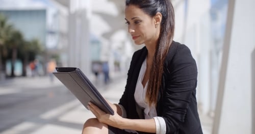 Business Woman Using Tablet Outside on Sunny Day