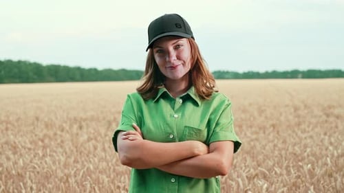 Portrait of Young Woman Agronomist in Wheat Field