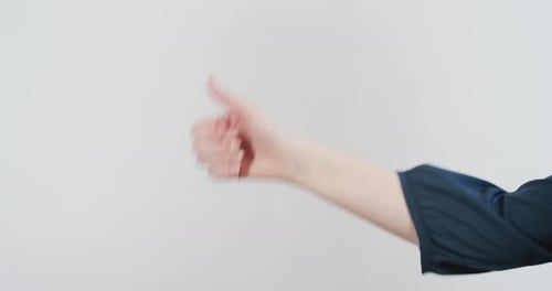 Arm and Hand Doing Thumbs-Up Gesture