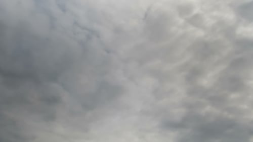 Storm Clouds Moving In The Blue Sky