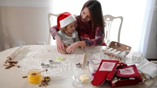 Mother Helping Daughter To Knead The Dough