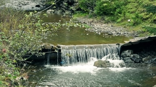 Mountain River With Small Waterfall