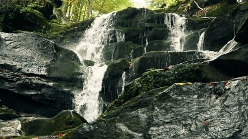 Waterfall In Mountains