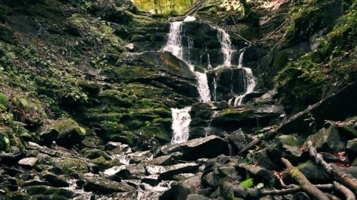 Waterfall In Mountains
