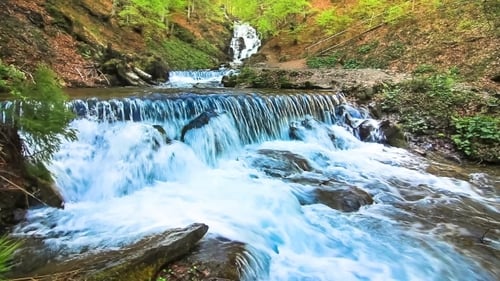 Picturesque Waterfall Cascading Through Forest
