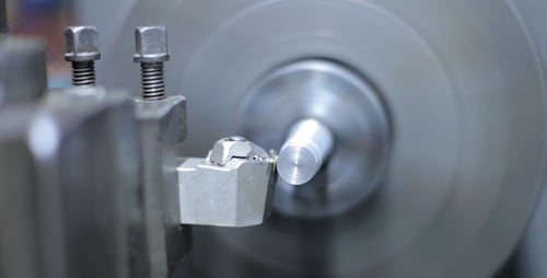 Close Up of Lathe Manufacturing Silver Metal