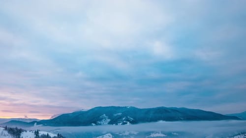 View in Foggy Sunset Winter Mountain