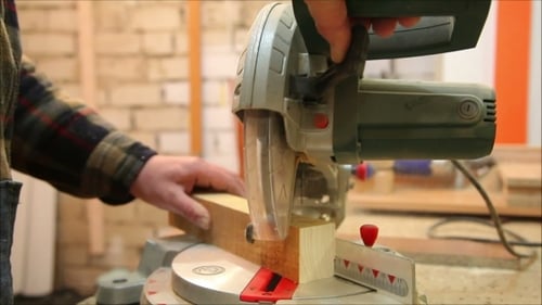 Woodworking Machine Cutting Wood in Close Up