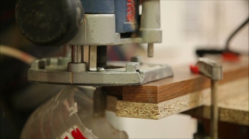 Worker Polishes The Surface Of The Wooden Board