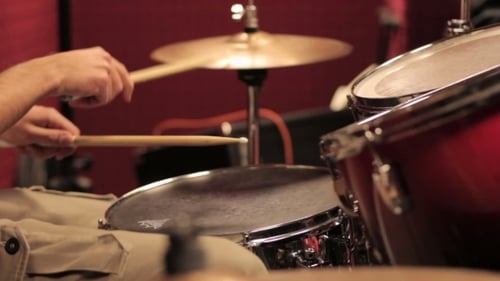 Young Man Playing The Drums