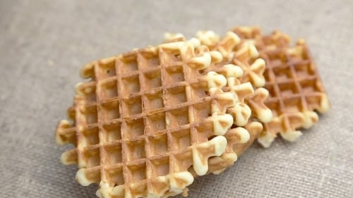 Golden Brown Waffles Close-Up on Linen Surface