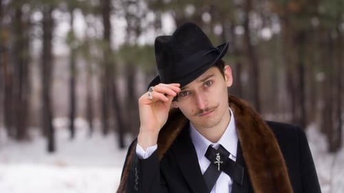 Young Adult Poses with Style in Winter Forest