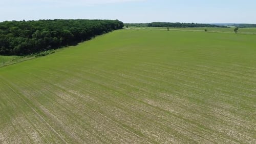 Aerial drone view of a flying over the rural agricultural landscape.